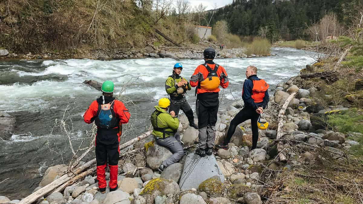 Scouting a rapid on the Hood River during our Class IV Rowing School