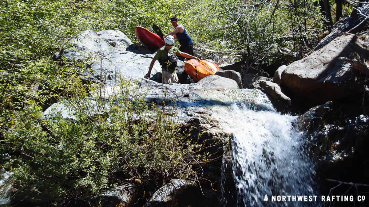Carrying our boats down Slide Creek