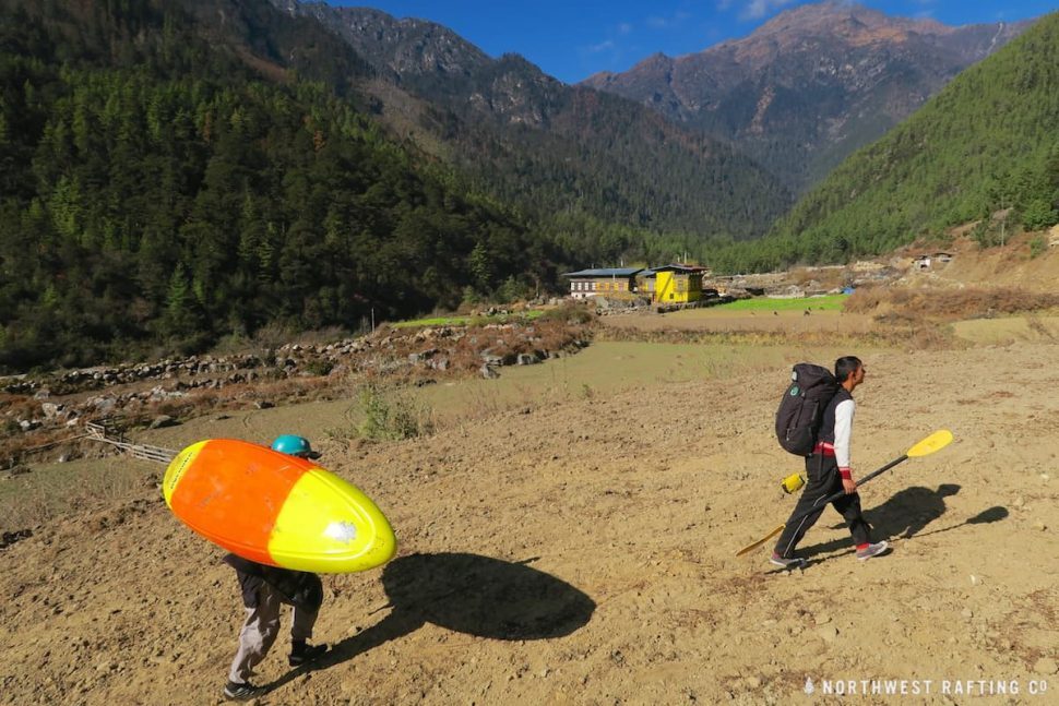 Portaging through farmer's fields on the Upper Paro Chhu