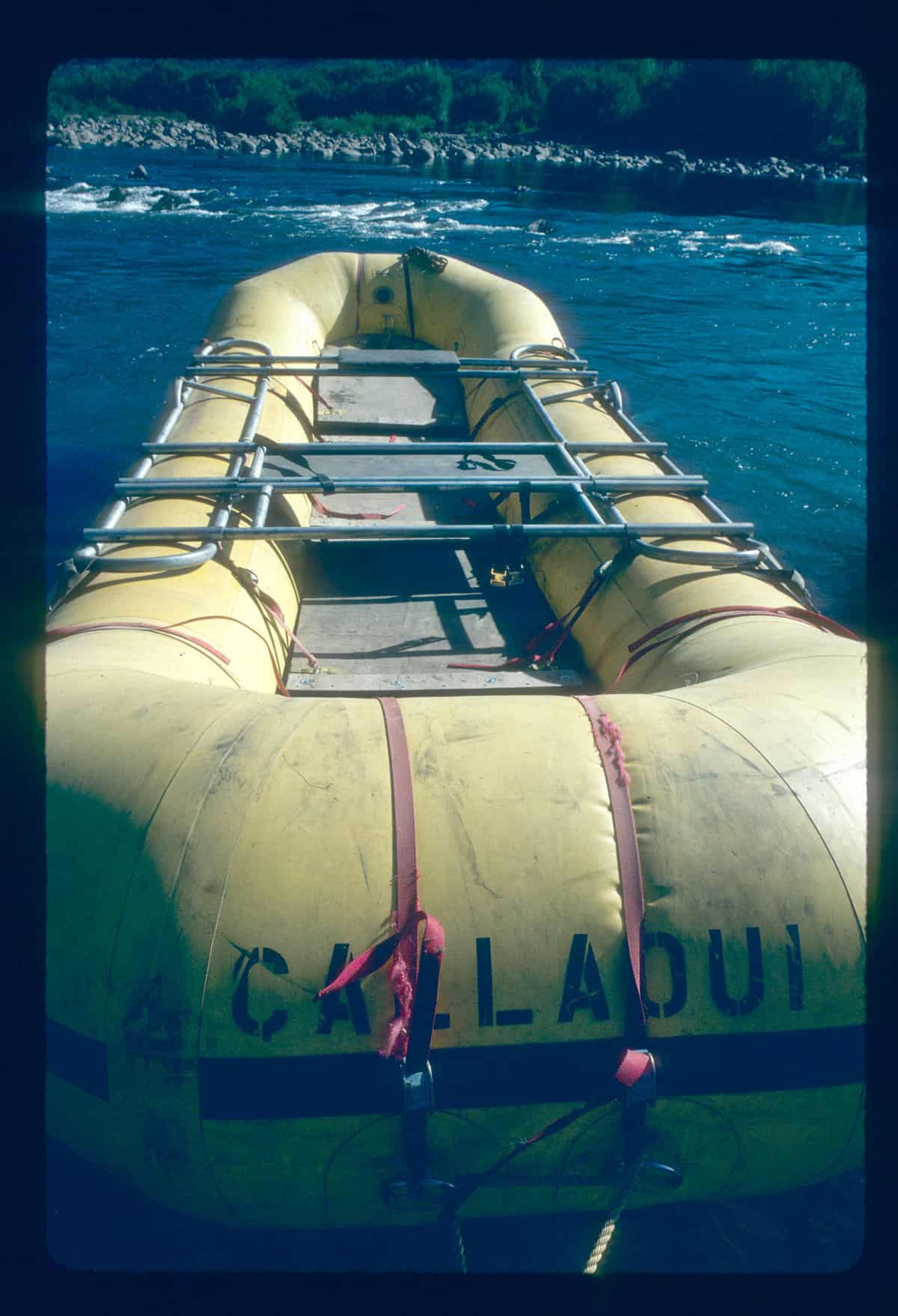 The Callaqui. My boat for Steve Currey Expeditions. Twenty two feet long with 32" tubes and no floor. Plywood decks hang from the frame. Named after the volcano overlooking the Bio Bio River canyon. | Photo by Peter Fox