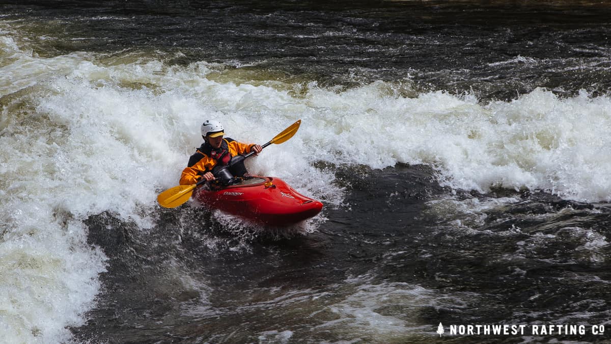 Surfing the wave at Marble Creek Rapid