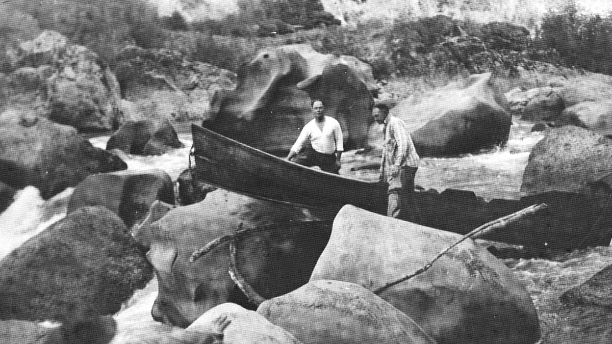 Glen Wooldrige and Mr. Degner portaging Blossom Bar before the channel was blasted with dyanmite