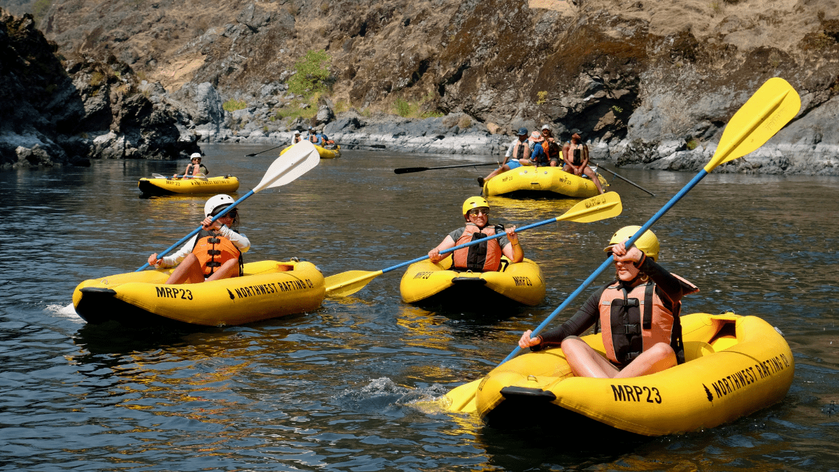 A family kayaking together on the Rogue River