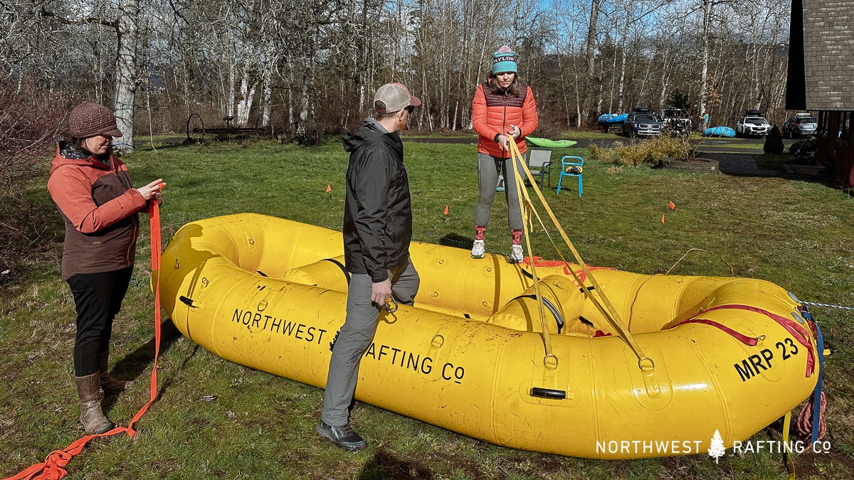 Practicing raft anchors in a river rescue course