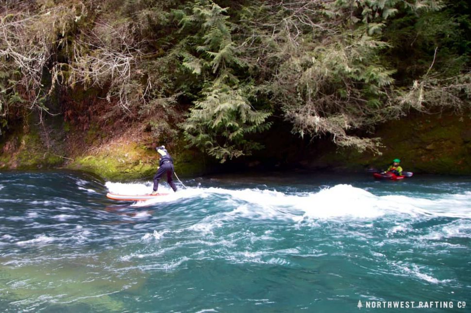 Tim surfing Dan's signature Starboard at the Cave Wave on the White Salmon River