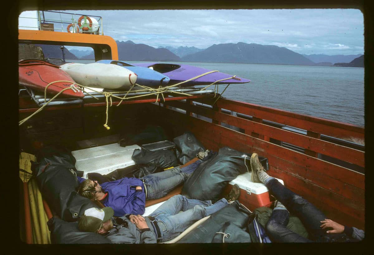 Our truck on the ferry from Chaiten to Chilhoe after the trip. Dan Bolster and Brad Lord. Note the 1980 era river footwear | Photo by Peter Fox
