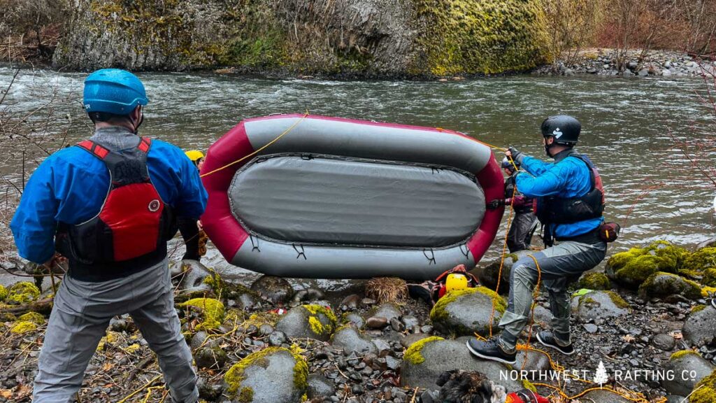 Practicing boat re-flipping techniques in our Class III Safety & Rescue Course